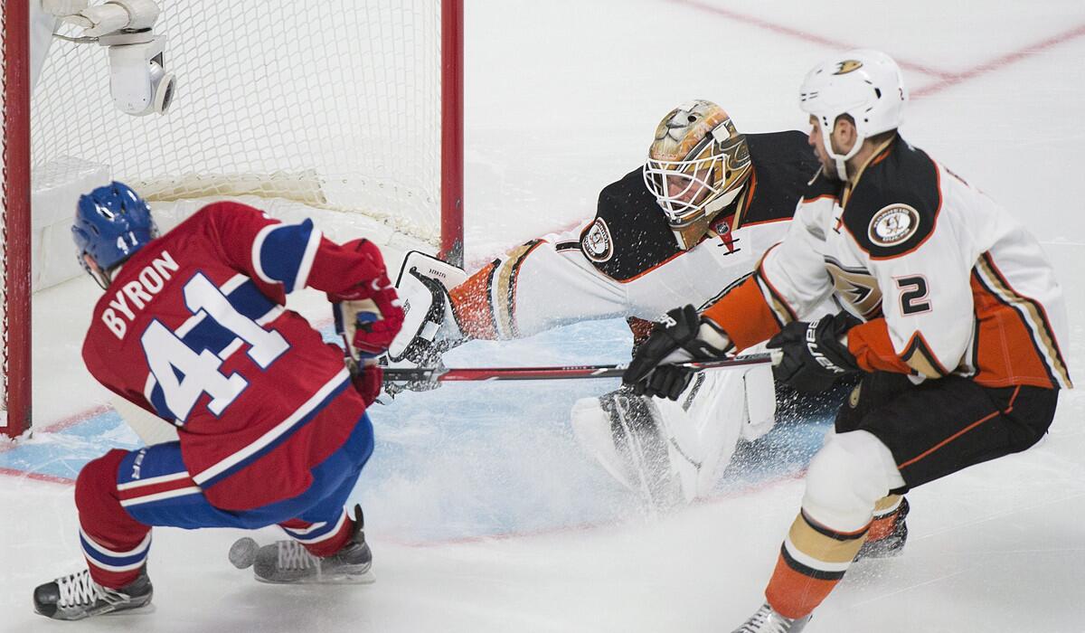Ducks goaltender Jonathan Bernier (1) makes a save against Montreal Canadiens' Paul Byron (41) as Ducks' Kevin Bieksa (2) defends during the first period on Tuesday.
