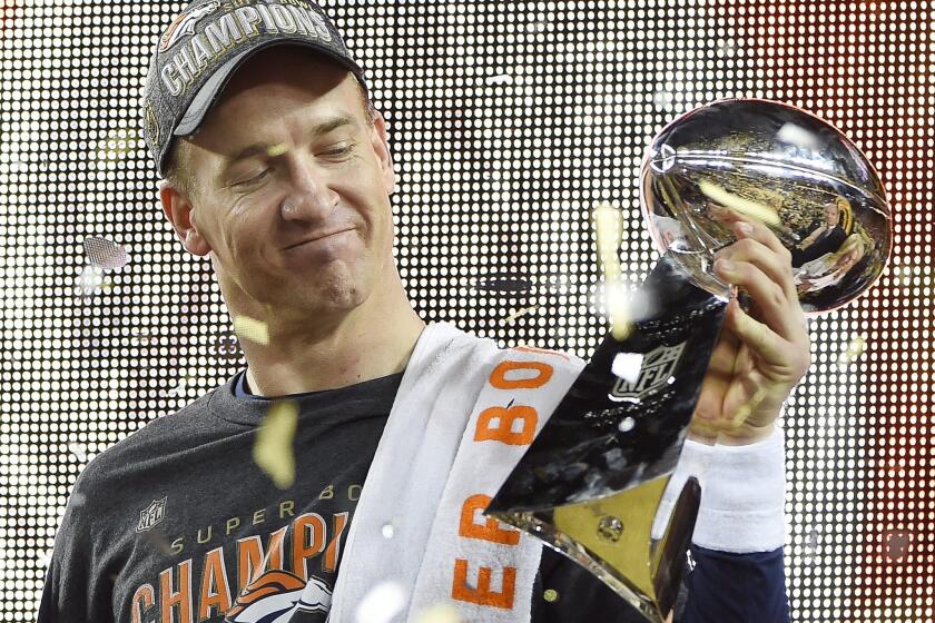 Peyton Manning holds the Vince Lombardi trophy after the Denver Broncos won Super Bowl 50 on Sunday night.