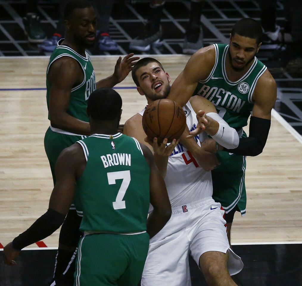 Clippers center Ivaca Zubac gets fouled on the way to the basket during a game Nov. 20 against the Celtics at Staples Center.