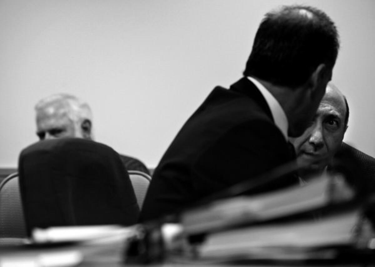 LOS ANGELES, CA -- MONDAY, NOVEMBER 5, 2012 -- Attorney Daniel R. Friedenthal , left, talks with pharmacist Albert Daher, the owner of Jay Scott Drugs in Burbank. The California Board of Pharmacy has requested that the licenses of Daher, two other phrmacists and Jay Scott Drugs be revoked. In an interview, he denied wrongdoing and said he was "extremely vigilant" in dispensing narcotics and looks forward to mounting a defense against the board accusation when the hearing continues next year.( Liz O. Baylen / Los Angeles Times )