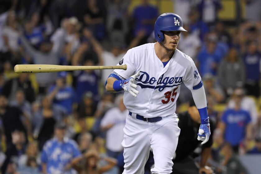 Los Angeles Dodgers' Cody Bellinger tosses his bat as he runs to first after hitting a solo home run during the eighth inning of the team's baseball game against the Tampa Bay Rays on Wednesday, Sept. 18, 2019, in Los Angeles. (AP Photo/Mark J. Terrill)