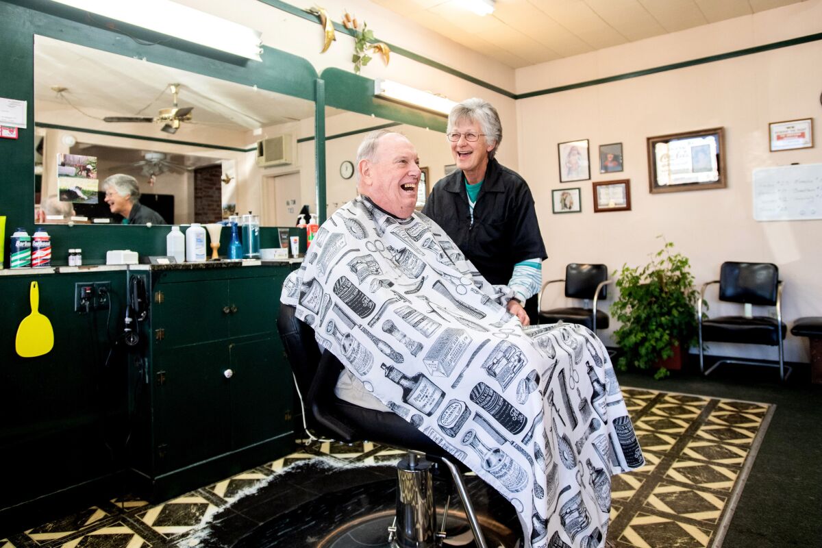 Kathryn Lees cuts Dan Yerxa's hair at the Sportsman barbershop in Colusa. “I know Jerry, so… welcome to Colusa," said Yerxa.