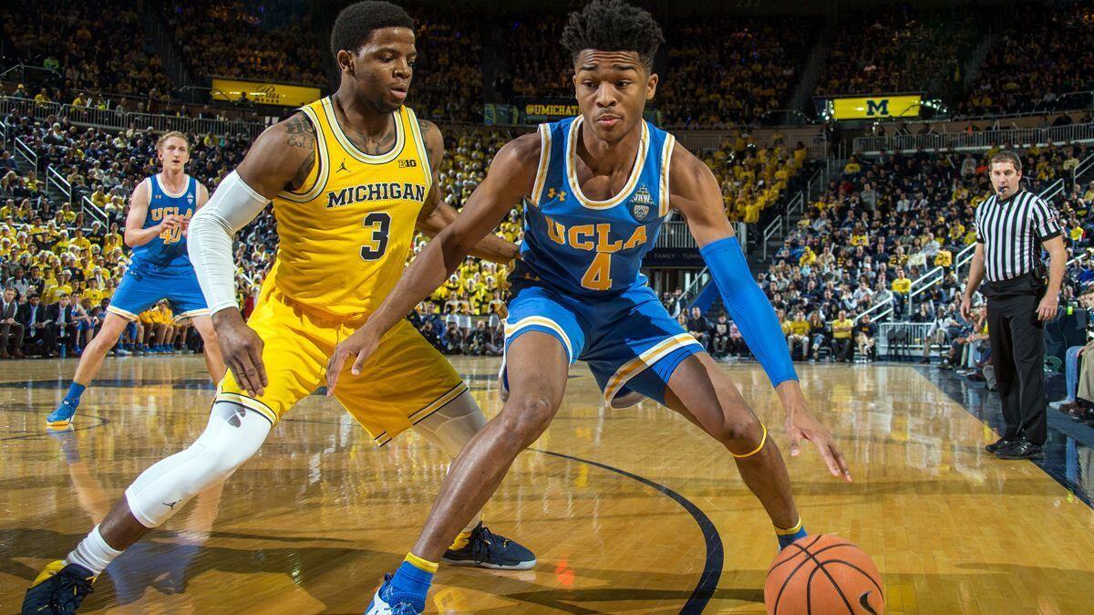 Michigan guard Zavier Simpson defends UCLA guard Jaylen Hands in the first half on Saturday in Ann Arbor, Mich.