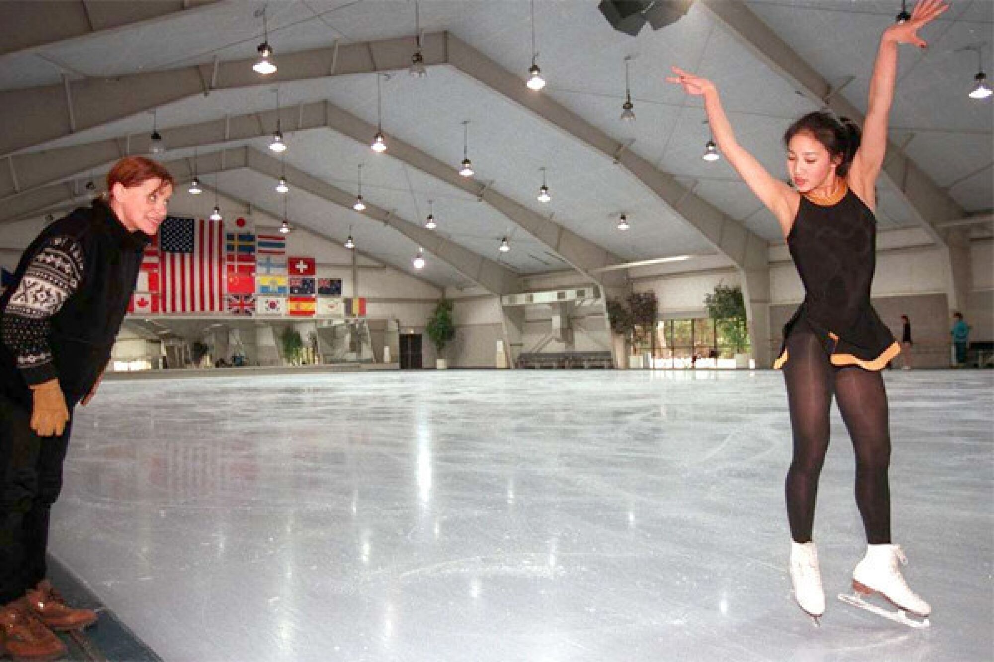 Michelle Kwan works on her choreography with Elena Tcherkasskaia at Ice Castle International Training Center in Lake Arrowhead in 1996. Kwan went on to win the silver medal at the 1998 Winter Olympics.