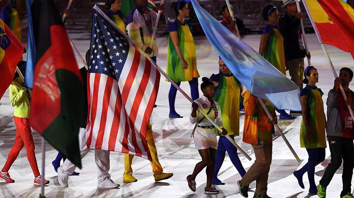 Flag bearer Simone Biles of United States walks during the "Heroes of the Games" segment during the Closing Ceremony on Day 16 of the Rio 2016 Olympic Games at Maracana Stadium on August 21, 2016 in Rio de Janeiro, Brazil.