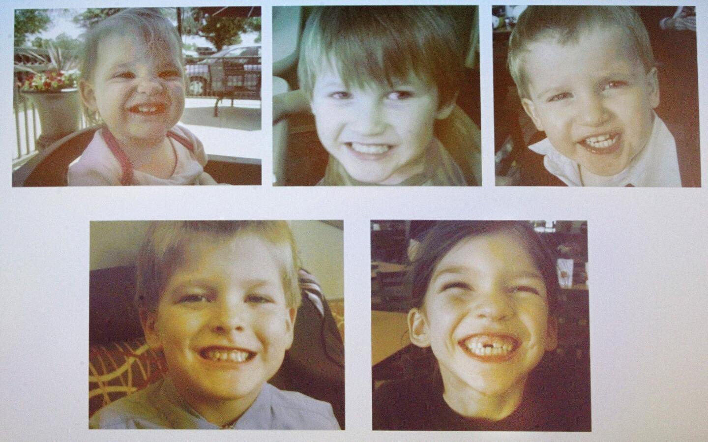 Projected on the screen during a news conference are photographs of the five children of Timothy Jones, ages 1-8, whose bodies were found outside Camden, Ala. Jones is being held in the children's deaths.