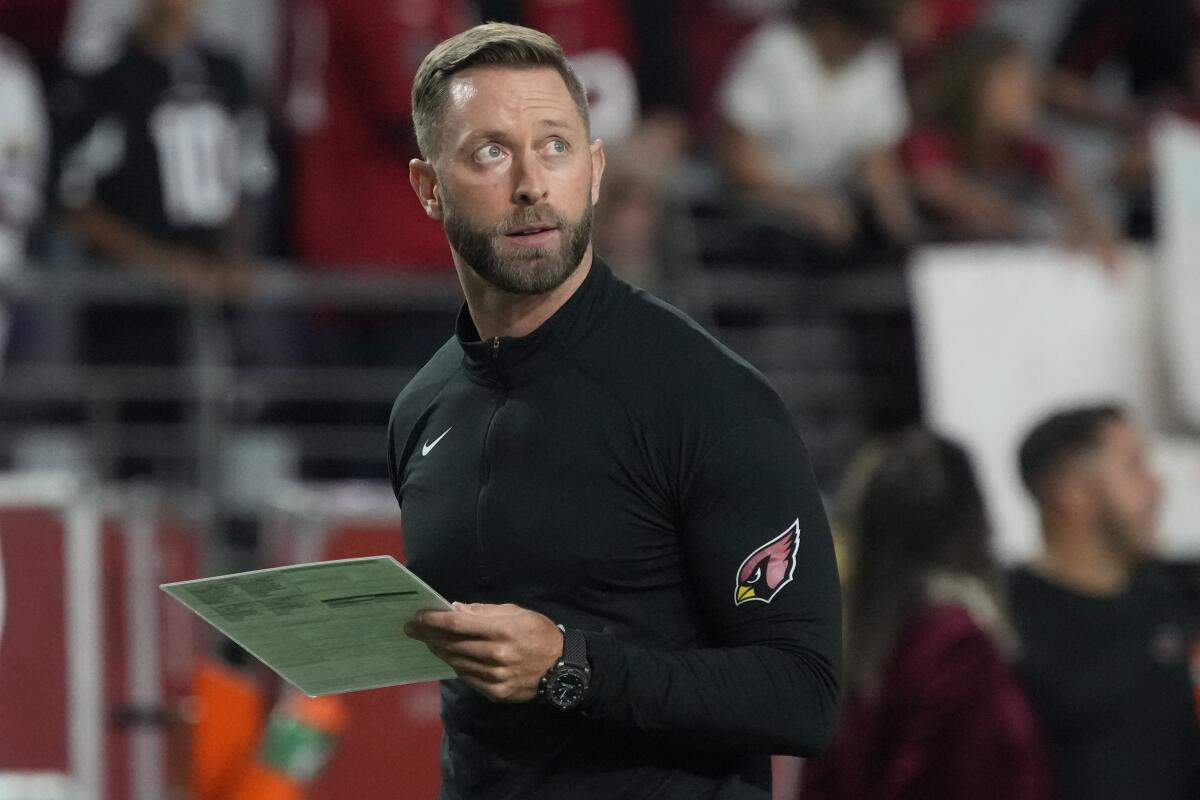 Arizona Cardinals coach Kliff Kingsbury looks up from the sideline during a game