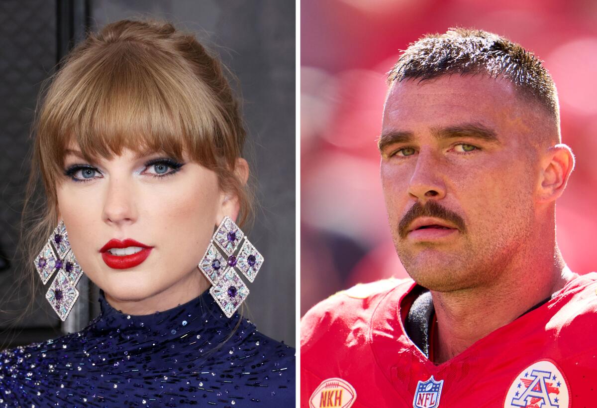 Taylor Swift in a blue turtleneck dress and big earrings and Travis Kelce in a Kansas City Chiefs uniform