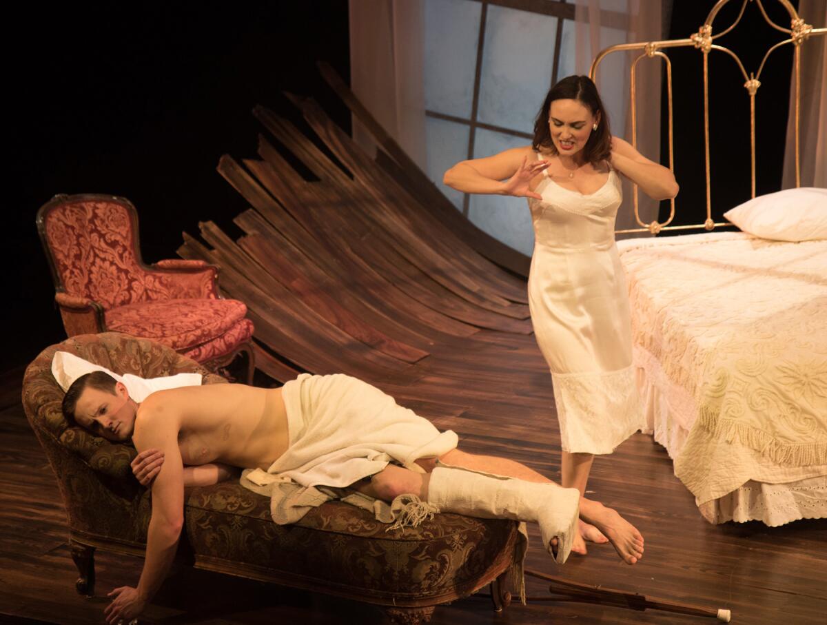 Ross Philips is Brick and Rebecca Mozo portrays Maggie in Antaeus Theatre Company’s revival of Tennessee Williams’ “Cat on a Hot Tin Roof.” (Steven C. Kemp)