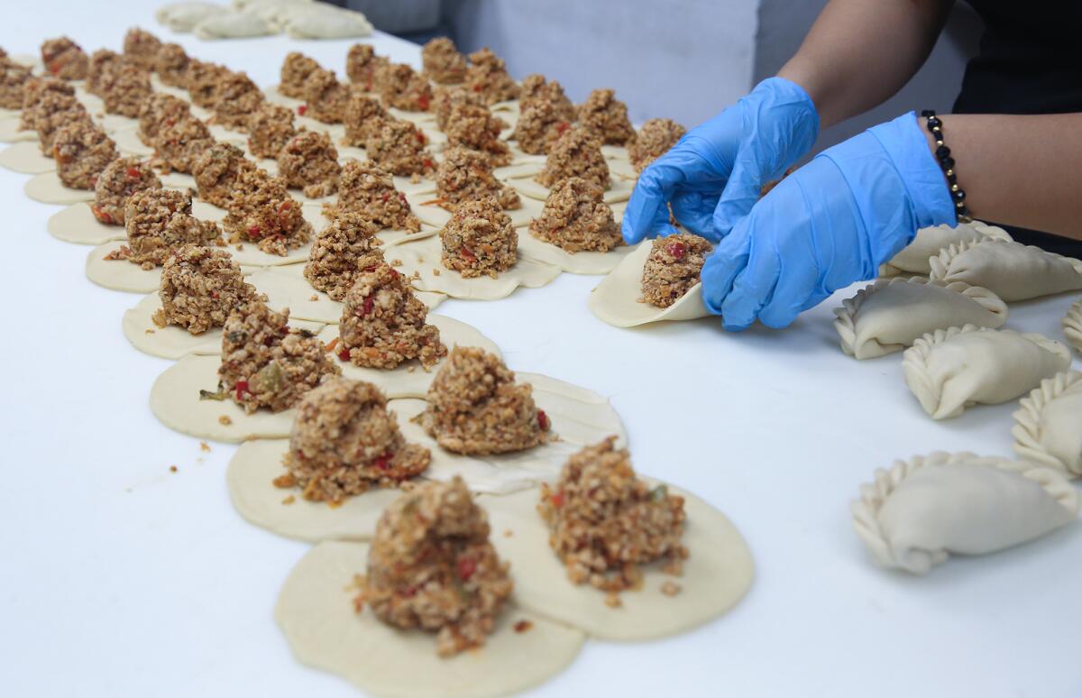 Empenadas made by hand at Leo and Teresa Razo's Villa Roma restaurant and market in Laguna Hills.