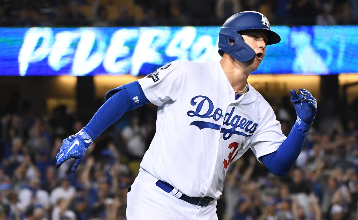 Dodgers' Joc Pederson celebrates his solo home run against the Washington Nationals during the eighth inning in Game 1 of the NLDS at Dodger Stadium on Oct. 3, 2019.