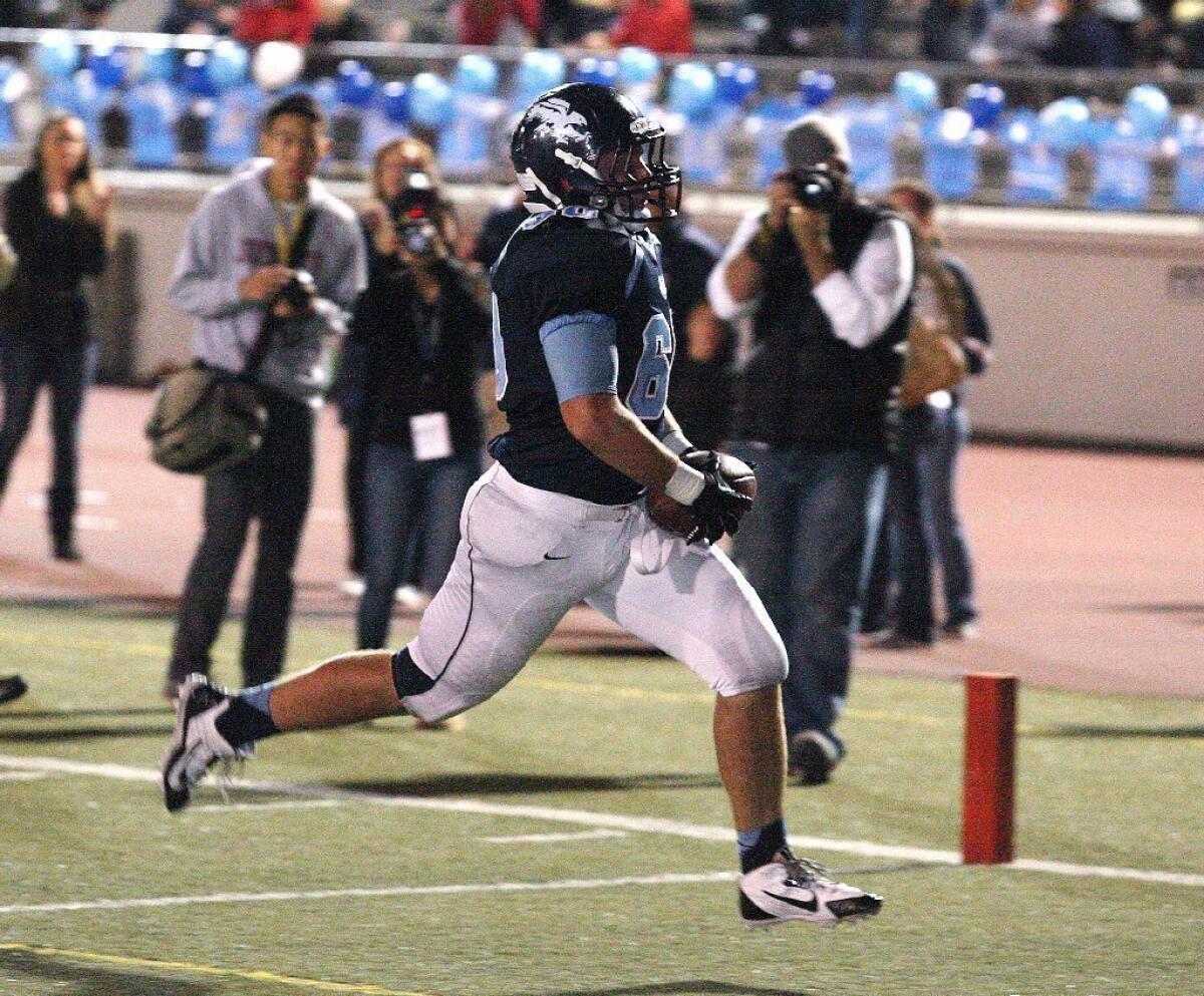 Crescenta Valley High football's Ryan Cancelosi coasts into the end zone during the Falcons' 48-47 overtime win over Burbank.