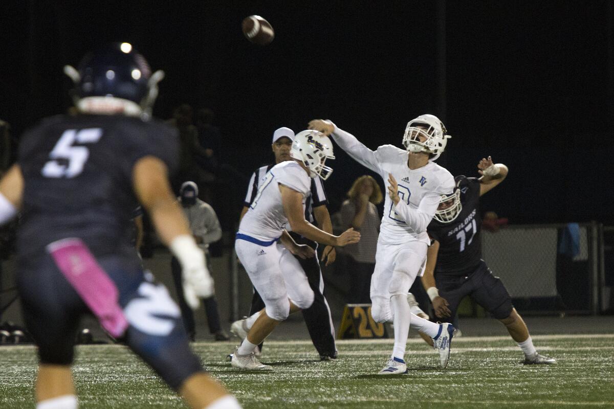Fountain Valley's Jimmy Russell throws a long pass in a Sunset League opener at Newport Harbor on Friday.