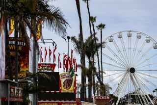 Del Mar, CA - May 31: A ferris wheels and various booths are setup before the official start of the 2023 San Diego County Fair at the Del Mar Fairgrounds on Wednesday, May 31, 2023 in Del Mar, CA. (Meg McLaughlin / The San Diego Union-Tribune)