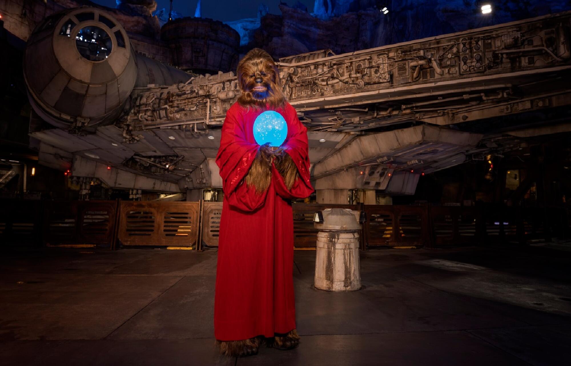 A 'Star Wars' Wookie holding an orb in a red robe. 