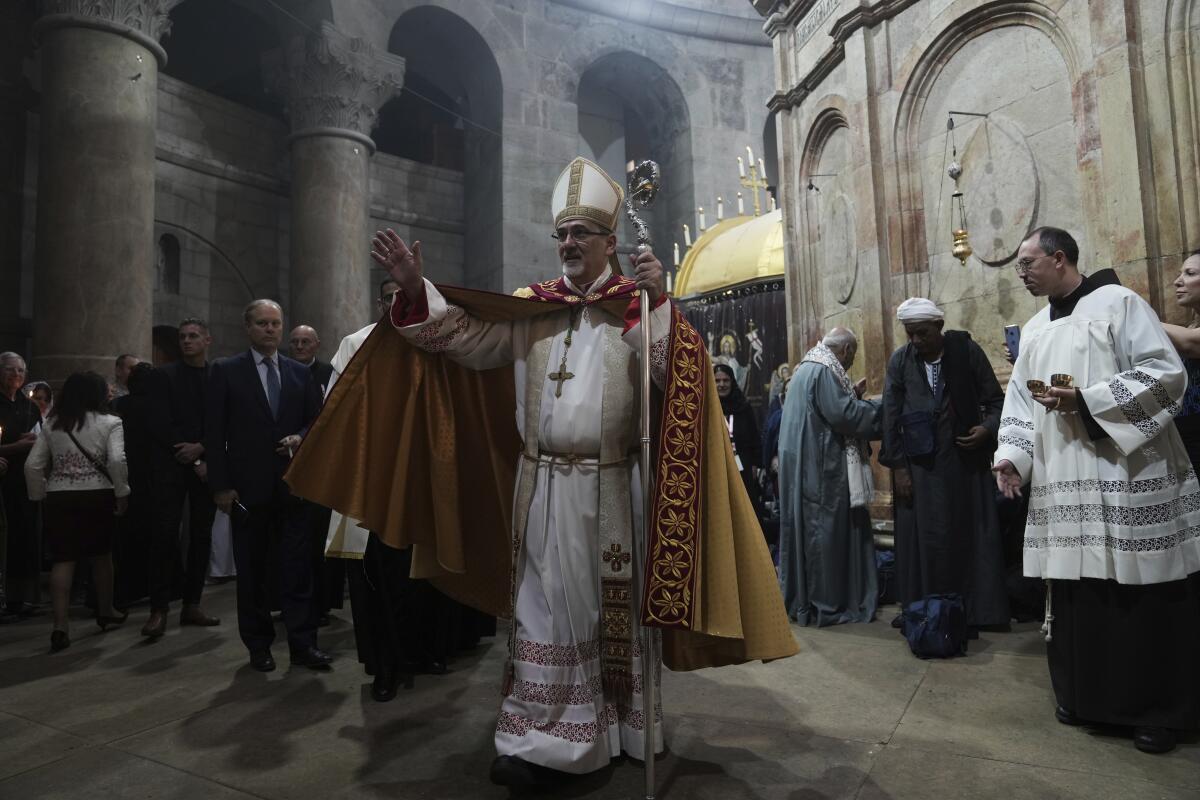 Latin Patriarch of Jerusalem Pierbattista Pizzaballa leads Easter Sunday Mass at a church in the Old City of Jerusalem.