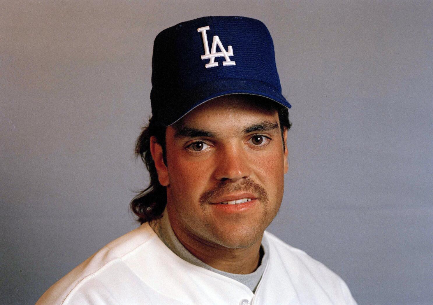 Mike Piazza has made it hard for Dodgers fans to share his
