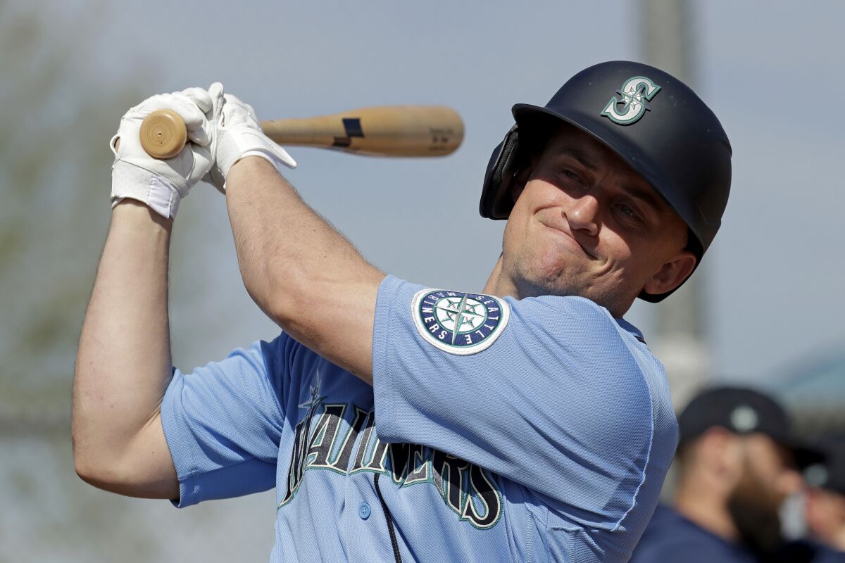 Seattle Mariners' Kyle Seager warms up before batting practice during baseball spring training Tuesday Feb. 18, 2020, in Peoria, Ariz.