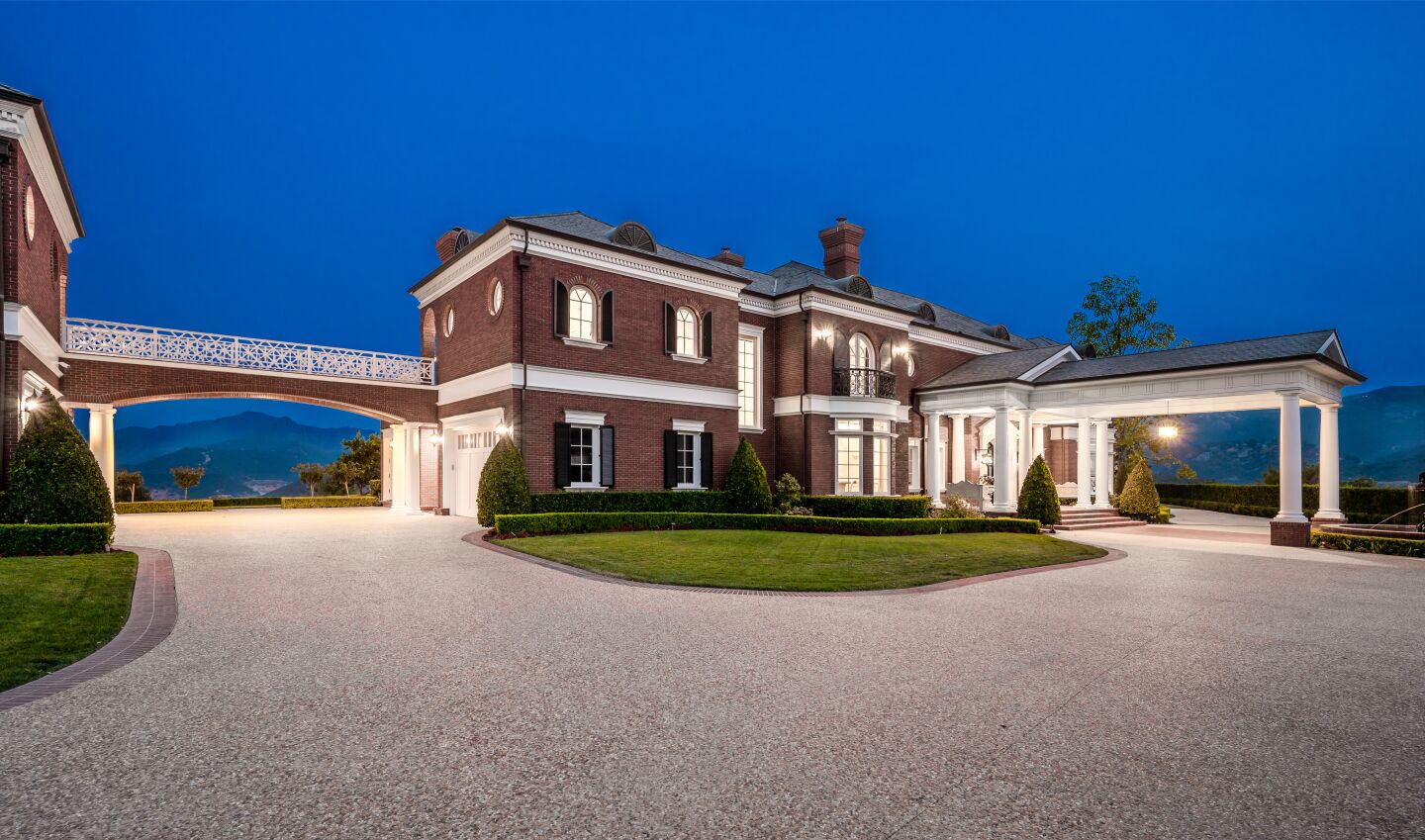 The Colonial-style home.