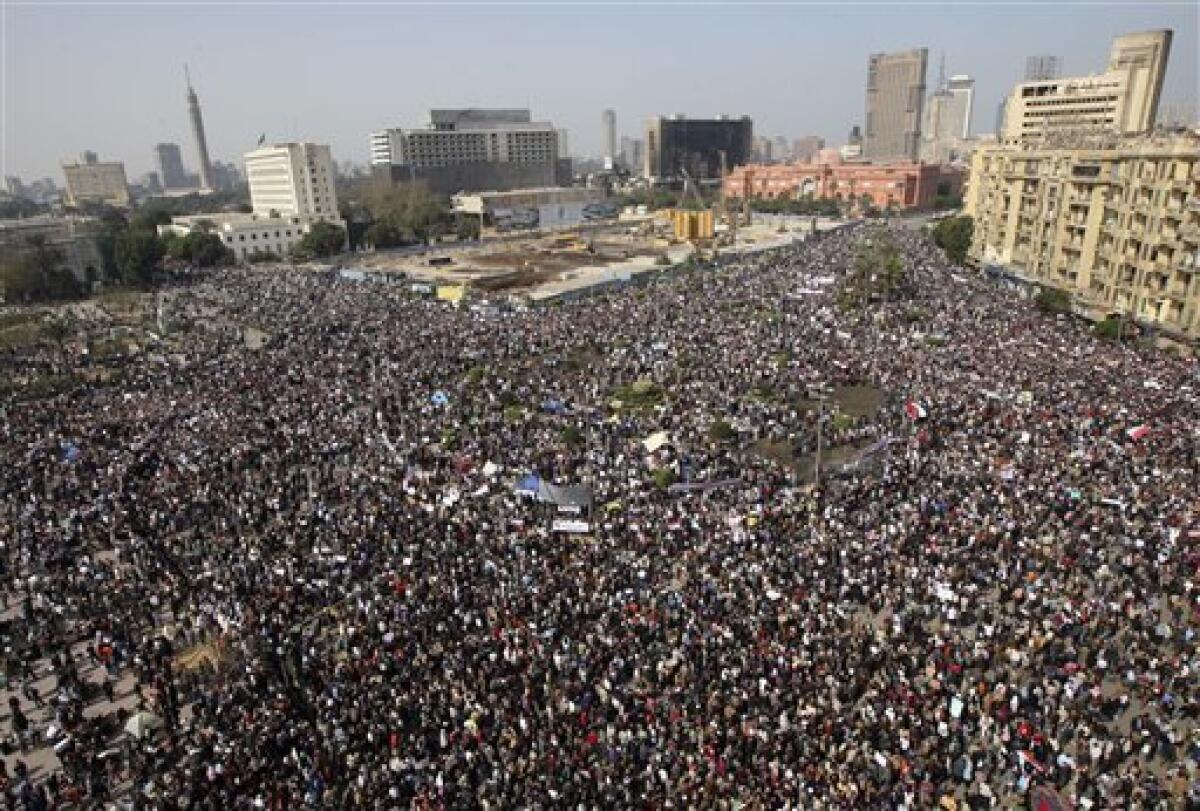 The crowd gathers in Tahrir, or Liberation, Square in Cairo, Egypt, Tuesday, Feb. 1, 2011. Tens of thousands of people flooded into the heart of Cairo Tuesday, filling the city's main square as a call for a million protesters was answered by the largest demonstration in a week of unceasing demands for President Hosni Mubarak to leave after nearly 30 years in power. (AP Photo/Khalil Hamra)