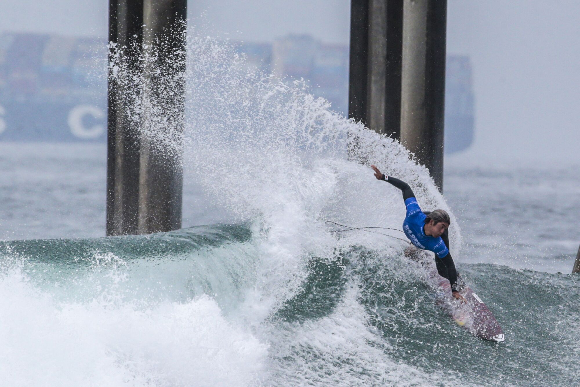 Kanoa Igarashi competes in a quarterfinal heat at the U.S. Open of Surfing