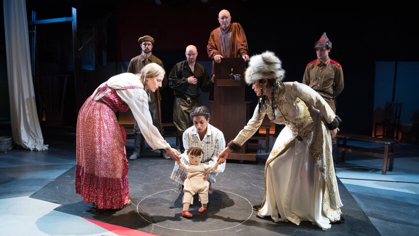 Child custody is settled the old-fashioned way in “The Caucasian Chalk Circle,” with, front from left, Liza Seneca, Gabriela Bonet and Claudia Elmore; in the rear, from left, Alex Knox, Turner Frankosky, Steve Hofvendahl and Troy Guthrie.