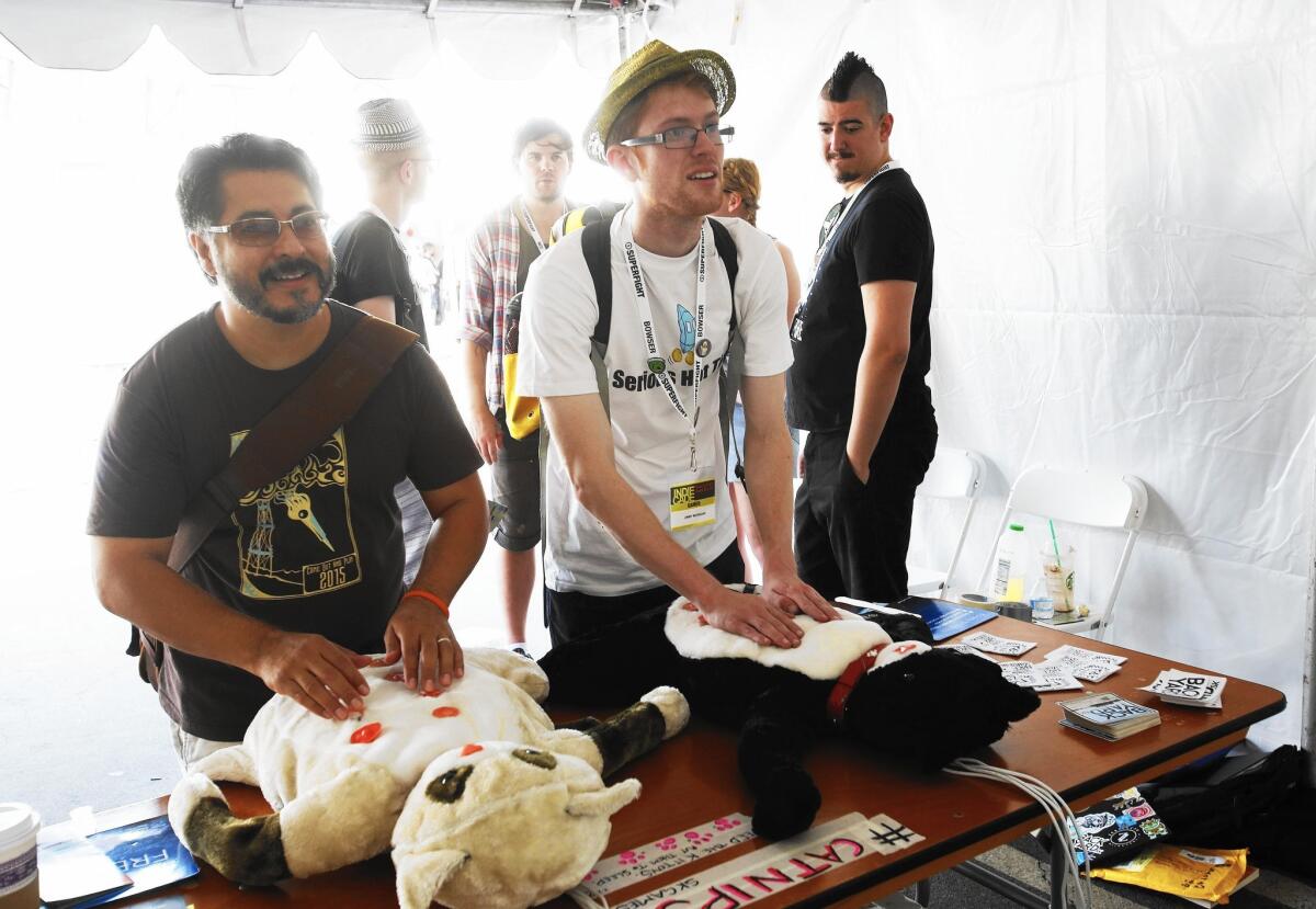 John Greg, left, and Jimmy Merrgan play "Catnips" during IndieCade in Culver City in October 2015.