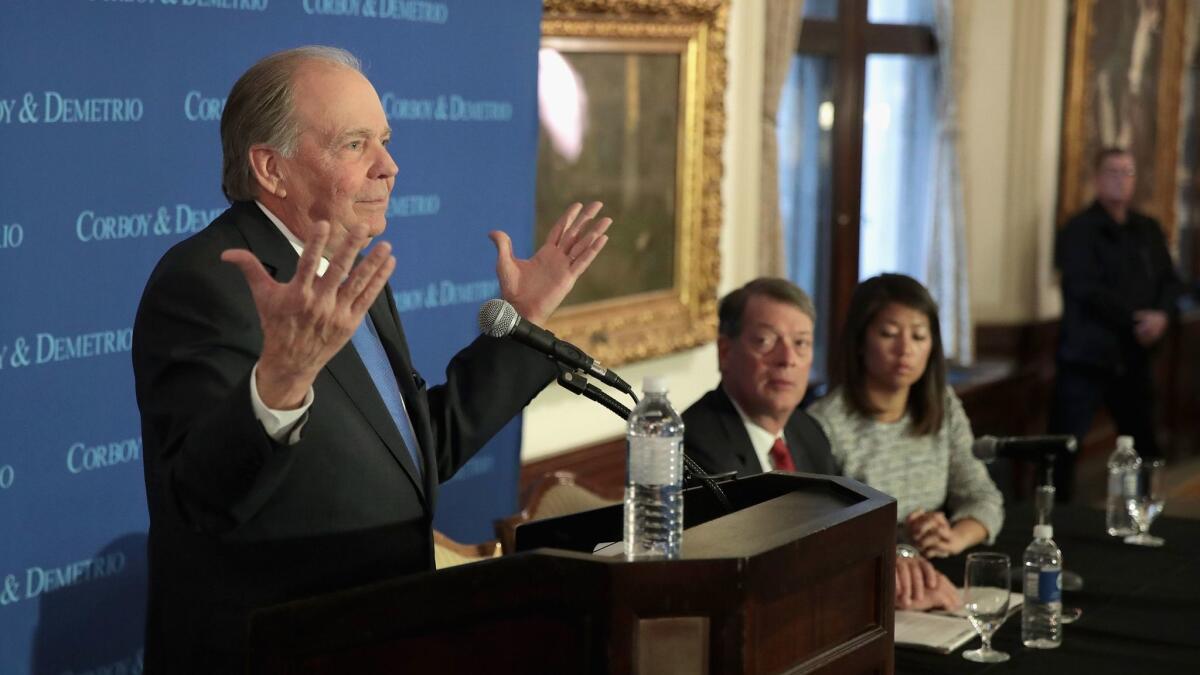 Attorneys Thomas Demetrio, left, and Stephen Golan hold a news conference with Crystal Dao Pepper, the daughter of Dr. David Dao, in Chicago on April 13.