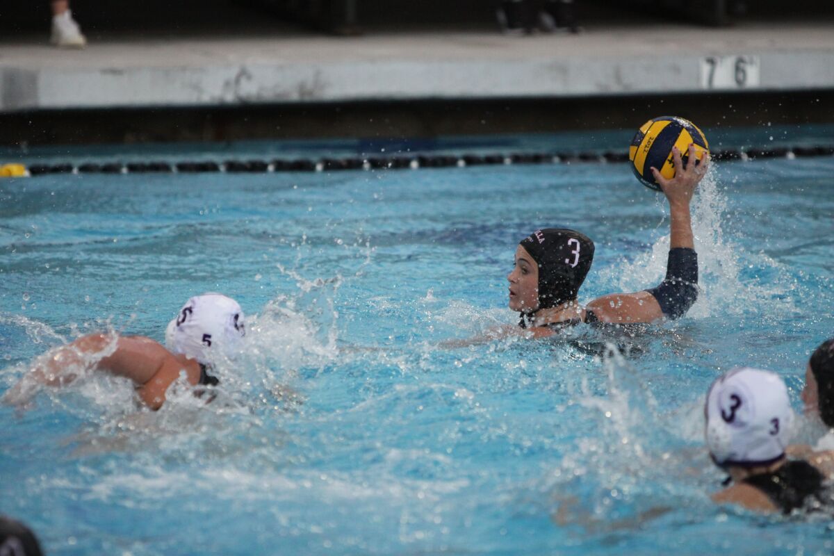La Jolla High's Lulu Hirschfield (in black cap) looks for an opening against Carlsbad in the CIF quarterfinals.