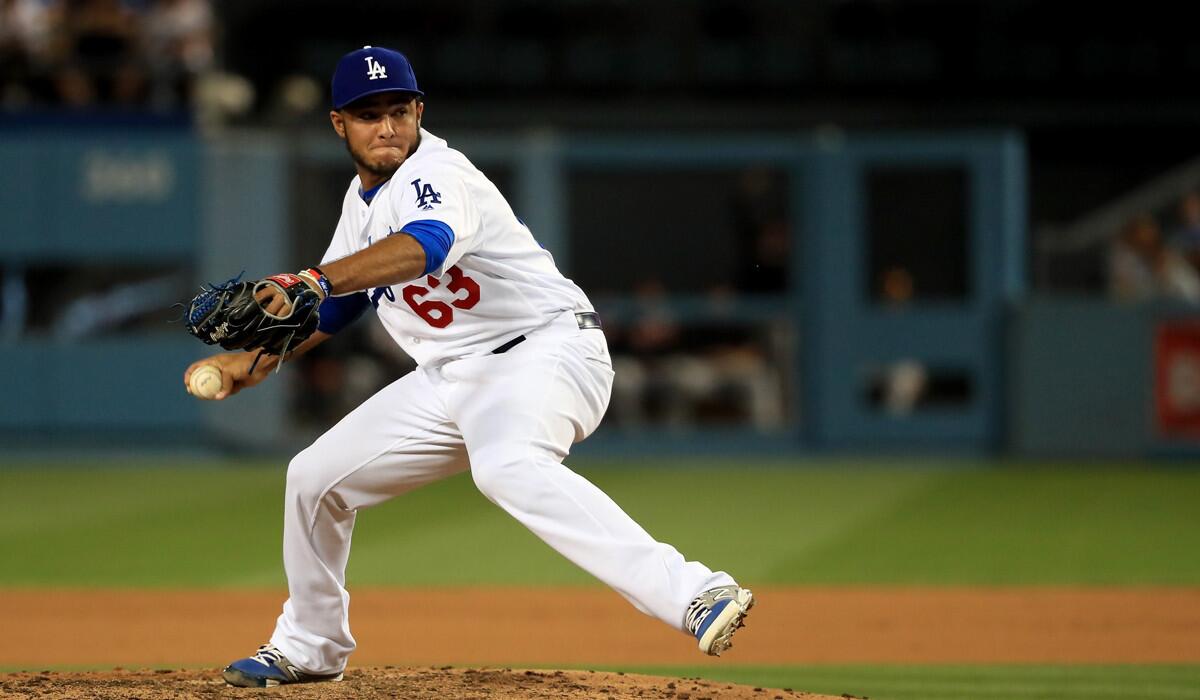 Dodgers' Yimi Garcia pitches in relief during the seventh inning against the San Francisco Giants at Dodger Stadium on April 16.