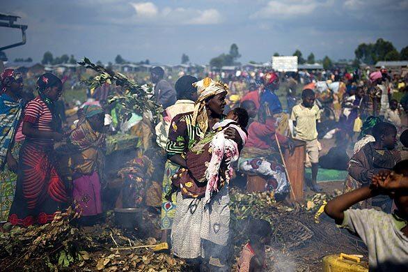 Displaced residents of the Democratic Republic of Congo gather in an improvised camp in Kibati. Thousands of people have fled violence between forces loyal to renegade Laurent Nkunda and the Congolese army.