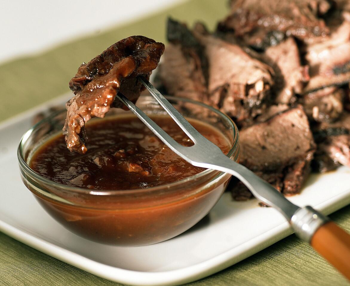 Texas hickory smoked brisket with coffee barbecue sauce. Click here for the recipe.