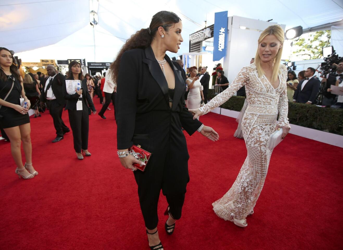 Actresses Polanco and Bowen greet each other on the red carpet as they arrive at the 23rd Screen Actors Guild Awards in Los Angeles