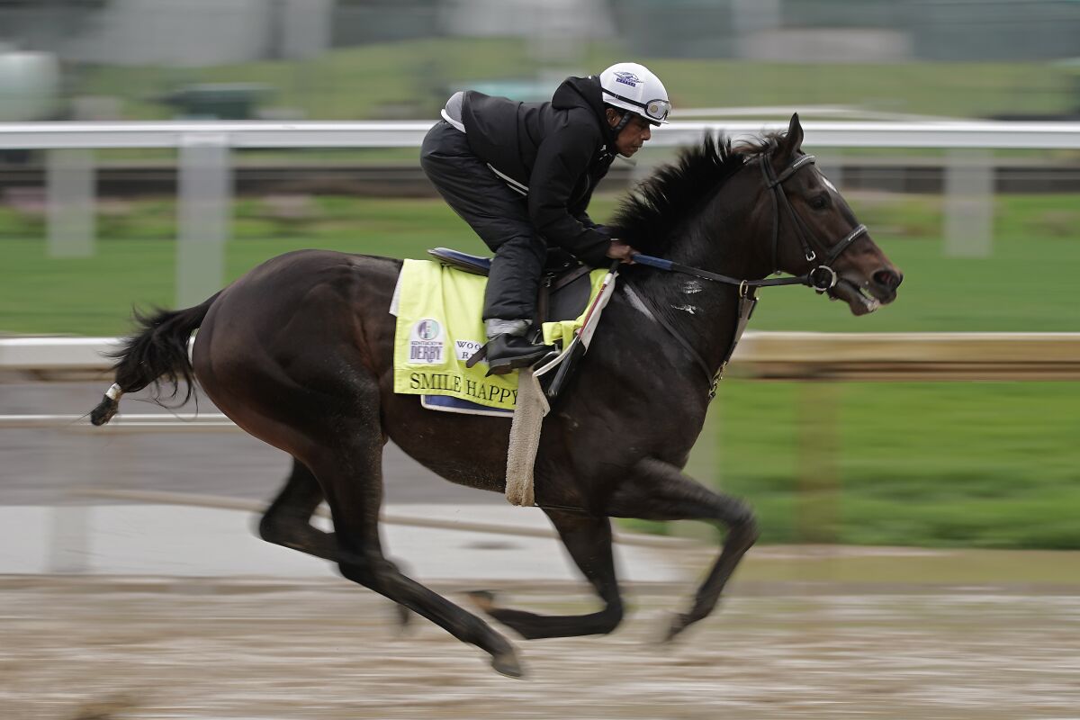 Kentucky Derby entrant Smile Happy works out at Churchill Downs on Tuesday.
