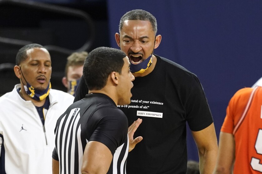 Michigan head coach Juwan Howard yells at a referee before receiving a technical foul in the second half of an NCAA college basketball game against Illinois in Ann Arbor, Mich., Tuesday, March 2, 2021. (AP Photo/Paul Sancya)