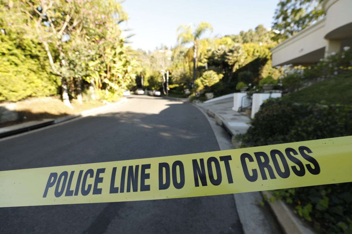 A street leading to the Beverly Hills home of Jacqueline and Clarence Avant is cordoned off.