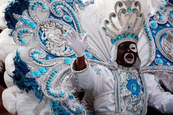 King Zulu waves to the crowd as his parade passes along Canal Street on Mardi Gras.