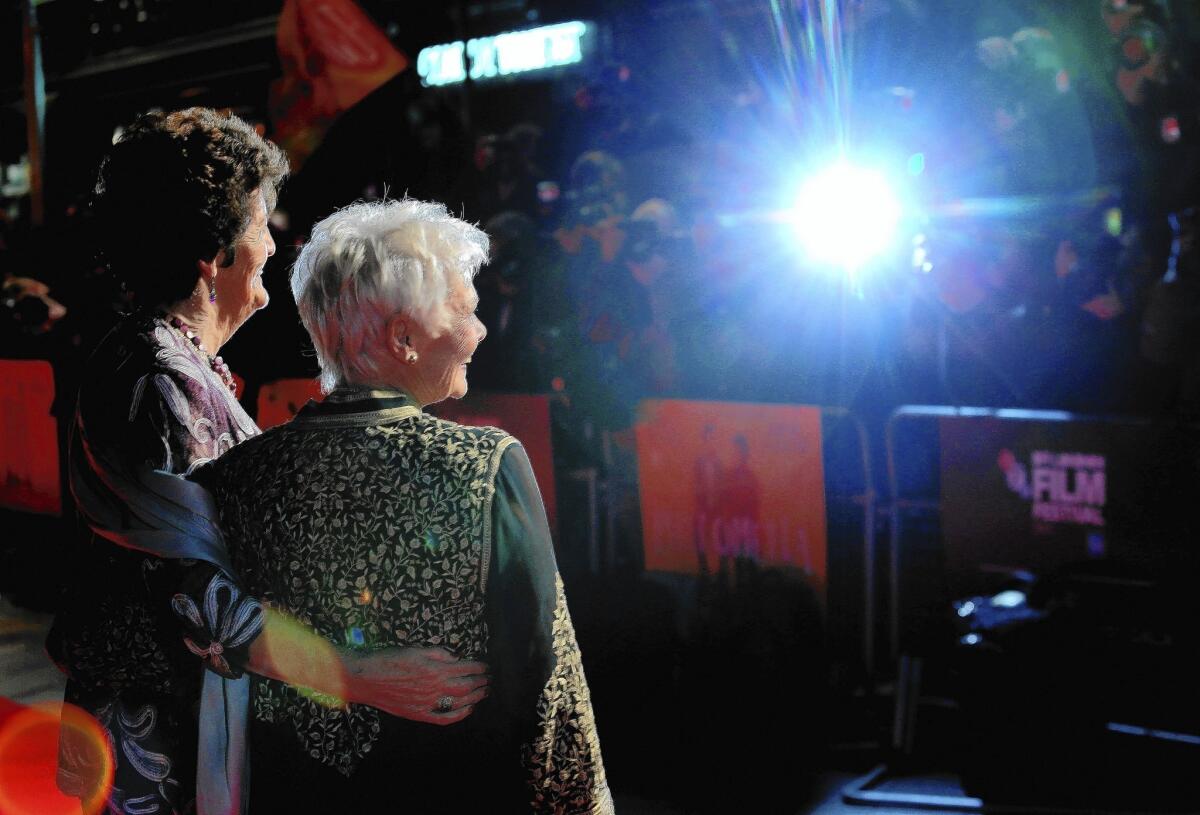 Actress Dame Judi Dench, right, and Philomena Lee attend the "Philomena" American Express Gala screening at Odeon Leicester Square on Oct. 16, 2013, in London.