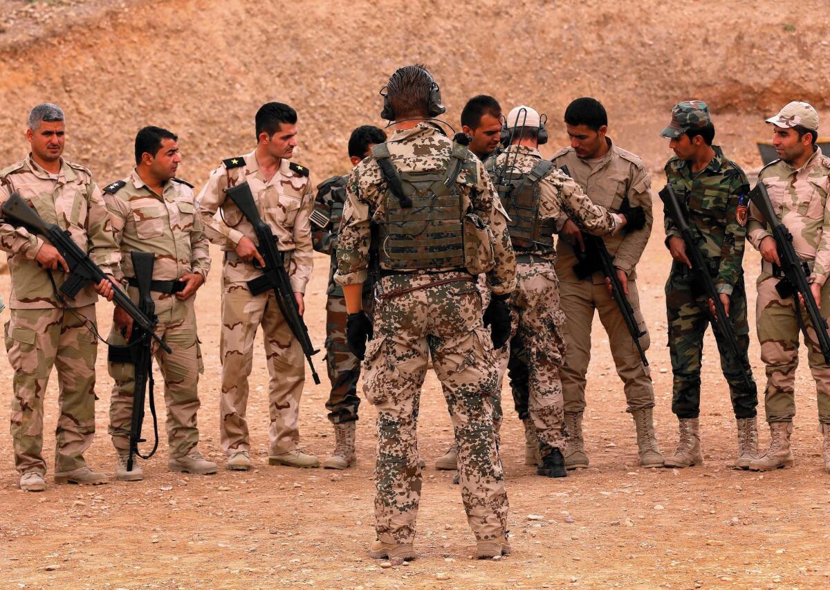 German military trainers instruct Kurdish peshmerga fighters in Irbil, Iraq, on Oct. 2. Kurdish commanders say the training by the U.S. and its allies is moving too slowly.