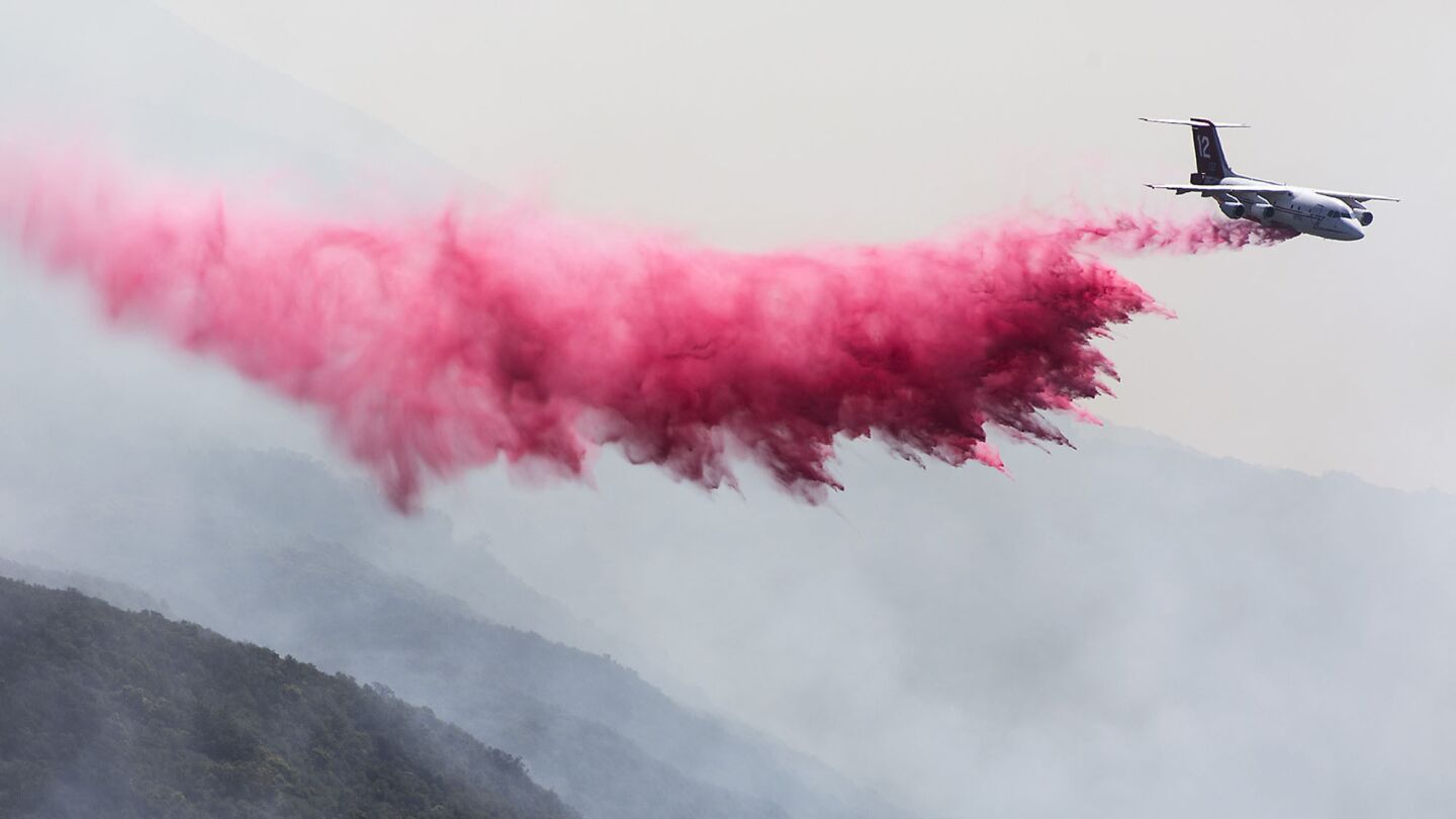 A jet drops fire retardant on the Sherpa fire as it consumes heavy brush along Refigio Road near Refugio Pass in Santa Barbara County.