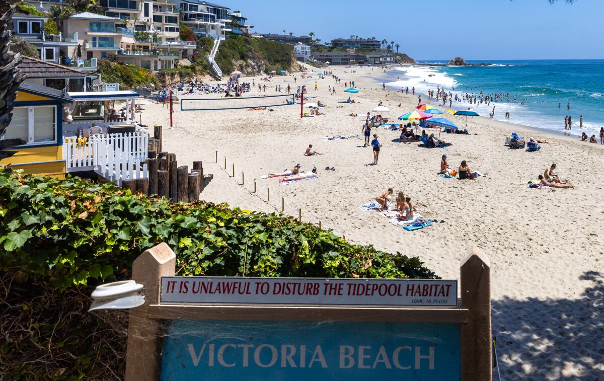 Beachgoers enjoy Victoria Beach in Laguna Beach