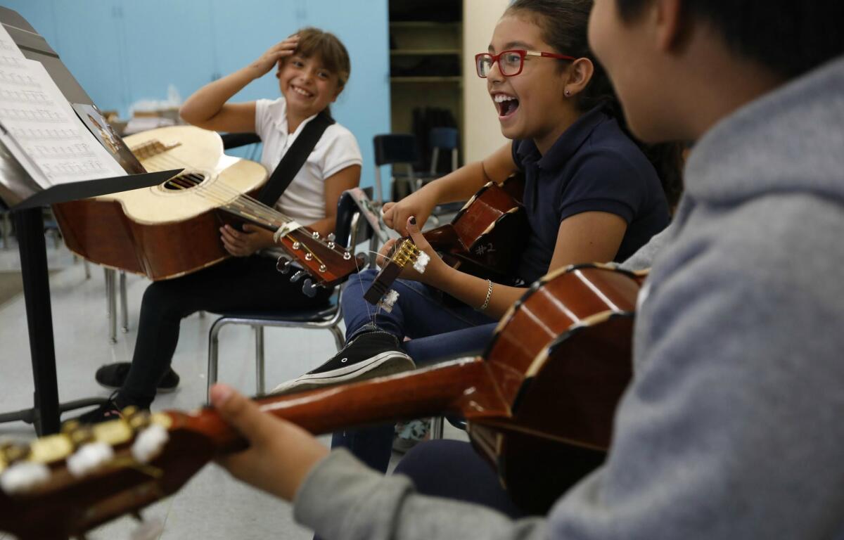 Angelica Razo, from left, Destiny Armijo and Angel Espinoza meet after school at Telfair Elementary for mariachi practice.