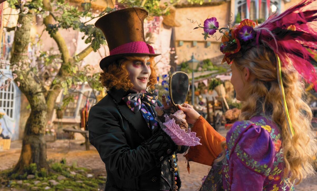Alice (Mia Wasikowska) returns to the whimsical world of Underland and travels back in time to save the Mad Hatter (Johnny Depp) in Disney's "Alice Through the Looking Glass." (Peter Mountain/Disney Enterprise)