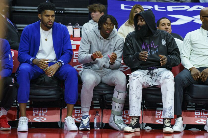 Philadelphia 76ers' Tobias Harris, left, Tyrese Maxey, center, and James Harden, right, look on from the bench during the second half of an NBA basketball game against the Minnesota Timberwolves, Saturday, Nov. 19, 2022, in Philadelphia. (AP Photo/Chris Szagola)