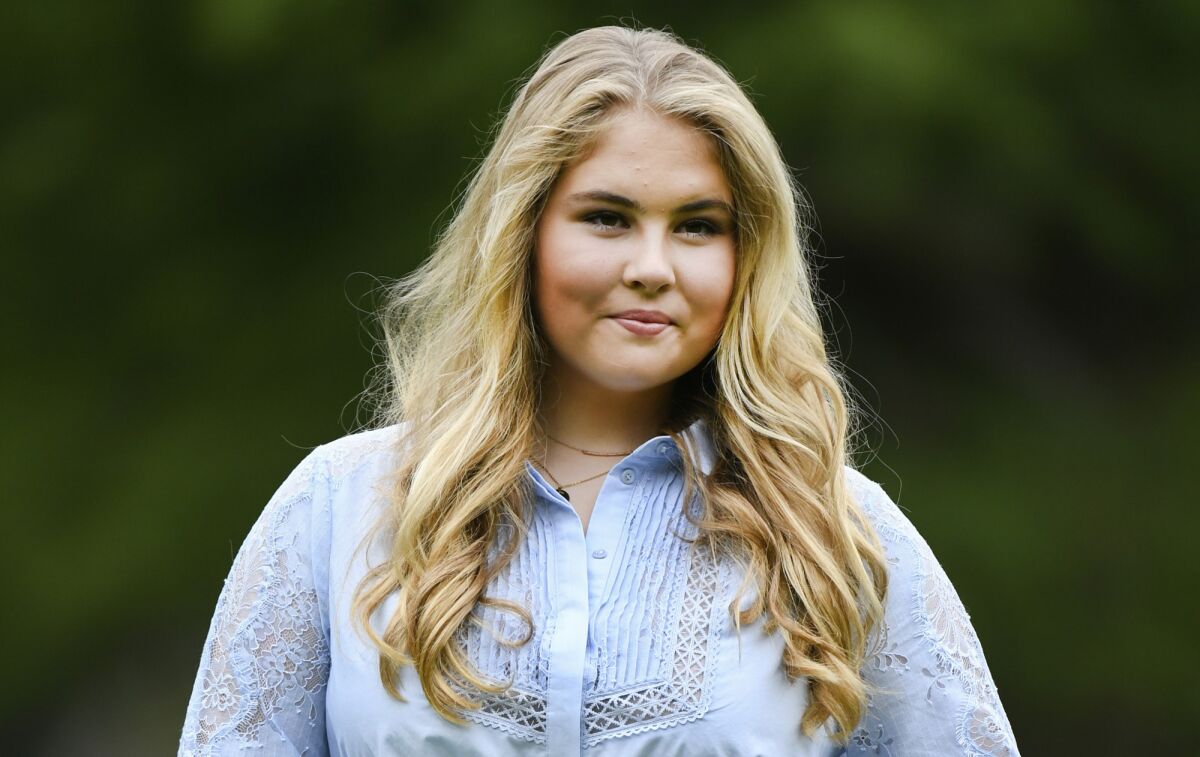 FILE - Netherlands' Princess Amalia poses in the garden of royal palace Huis ten Bosch in The Hague, Netherlands, Friday, July 17, 2020. People in the Netherlands could get to know their future queen a little better Tuesday Nov. 16, 2021, with the publication of an officially authorized book about Princess Amalia appearing weeks before her 18th birthday. (Piroschka van de Wouw, Pool via AP, File)