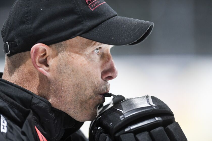 LOVELAND, CO - FEBRUARY 6: Colorado Eagles head coach Greg Cronin blows his whistle.