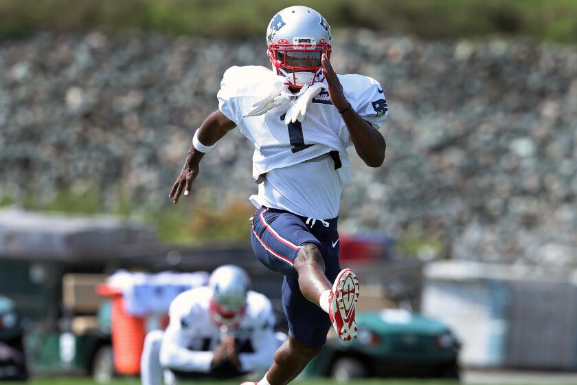FOXBOROUGH, MA - SEPTEMBER 11: Newly-signed New England Patriots wide receiver Antonio Brown, wearing the number 1, makes his debut at New England Patriots practice at Gillette Stadium in Foxborough, MA on Sep. 11, 2019. Behind him is new teammate Gunner Olszewski. (Photo by Jim Davis/The Boston Globe via Getty Images)