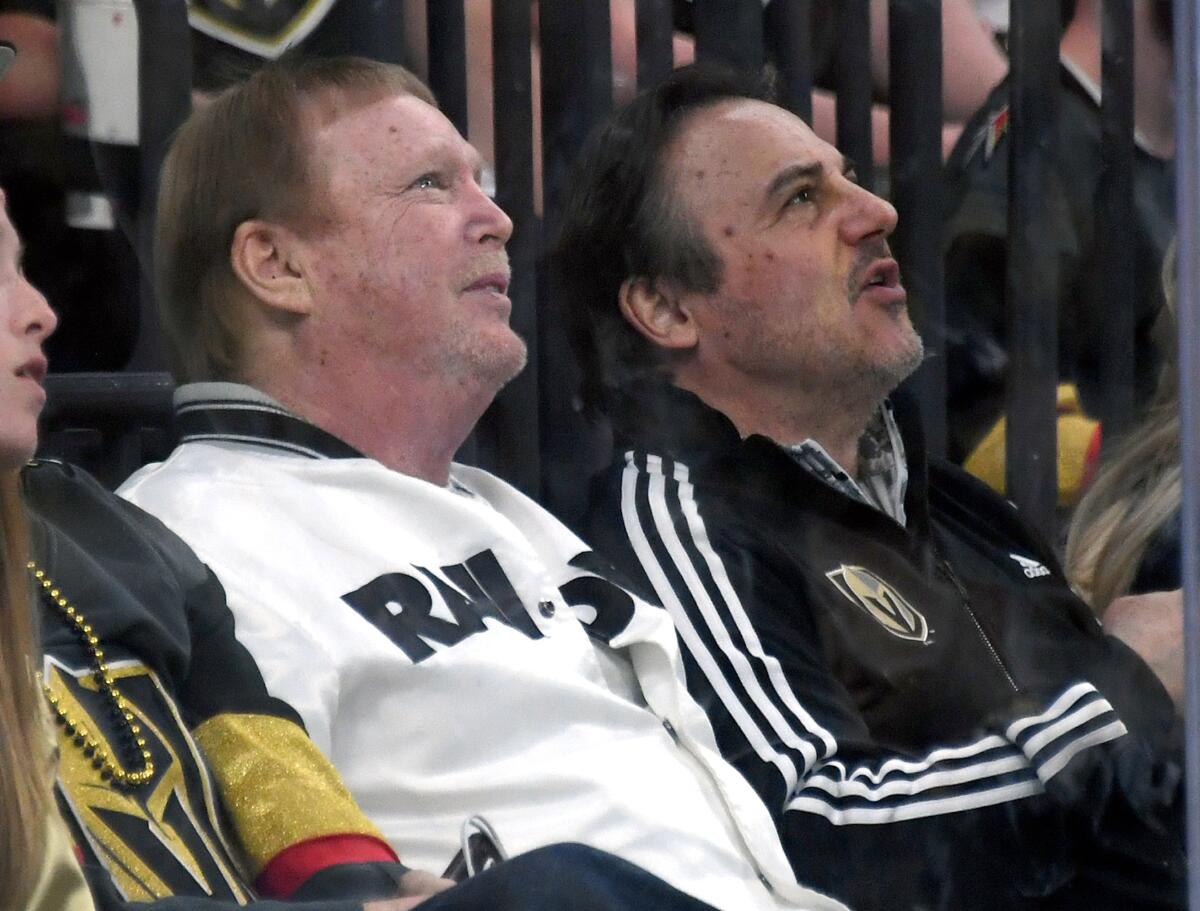 Oakland Raiders owner Mark Davis, left, and Vegas Golden Knights minority owner Gavin Maloof attend a Stanley Cup playoff game April 16 at T-Mobile Arena.