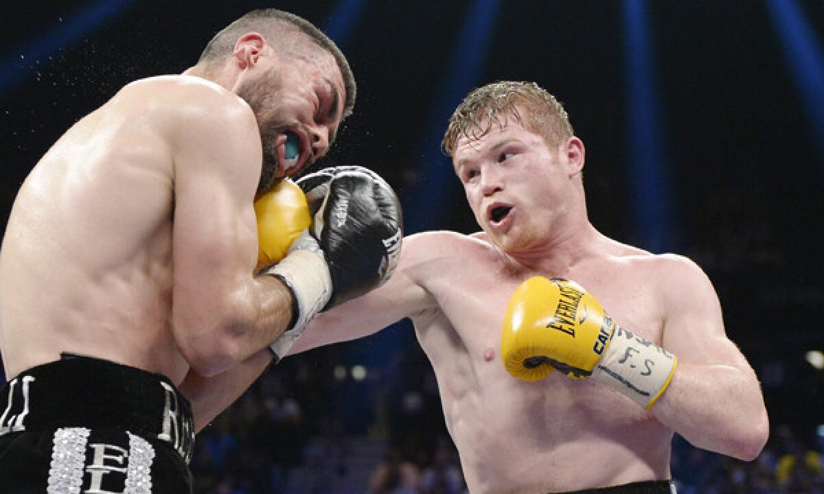 Saul "Canelo" Alvarez, right, punches Alfredo Angulo during their light-middleweight bout at the MGM Grand in Las Vegas on Saturday night. Alvarez won by technical knockout in the 10th round after the referee stopped the fight.