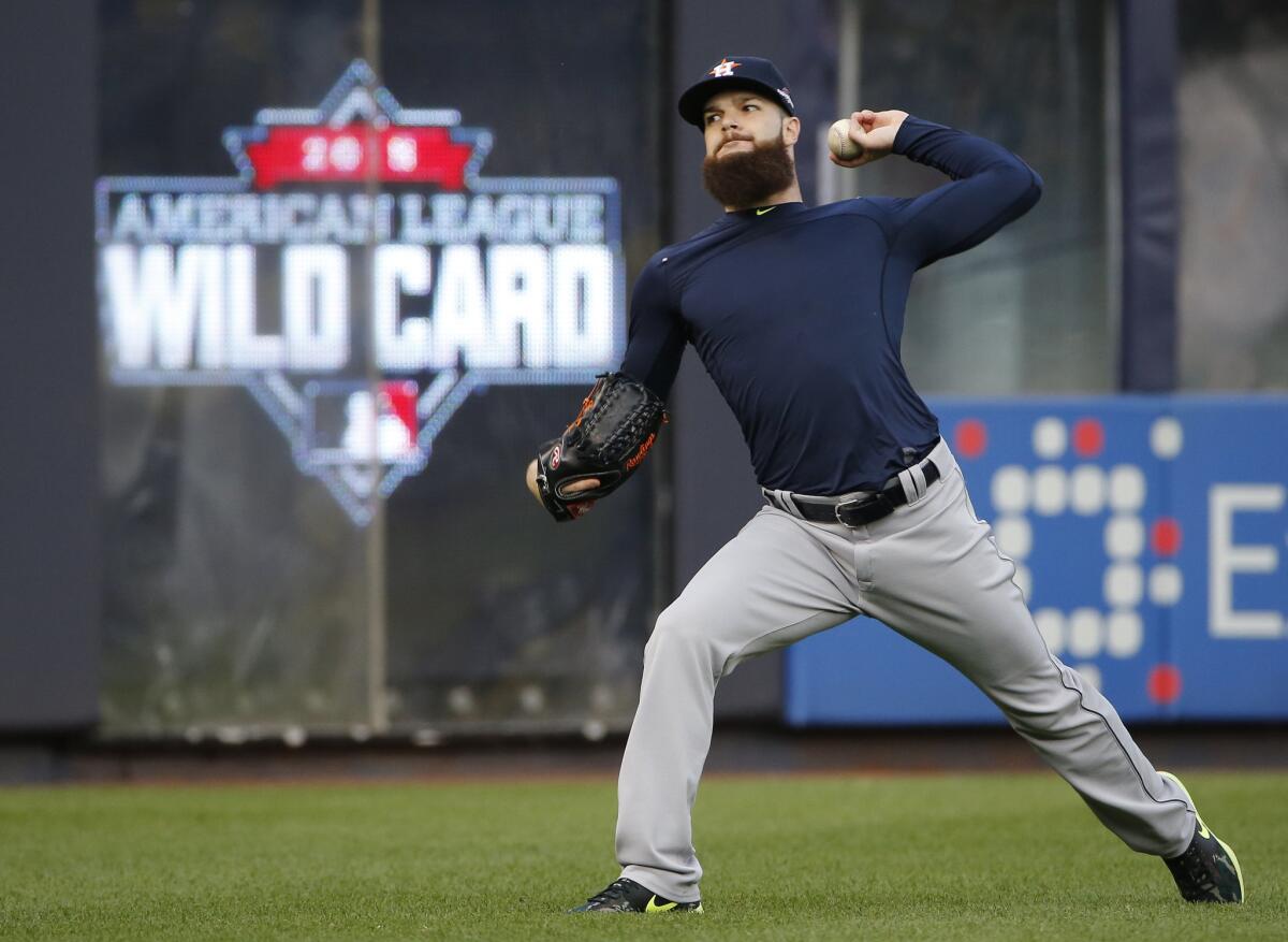 Astros starting pitcher Dallas Keuchel throws on the field Monday in preparation for his start in the American League Wild Card game against the Yankees on Tuesday.